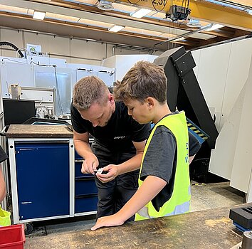 Alupress Tooling employee with young inventor