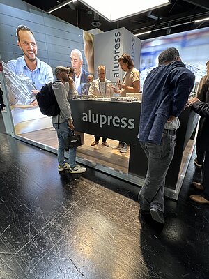 Alupress experts with visitors at the stand at PCIM Europe 2024